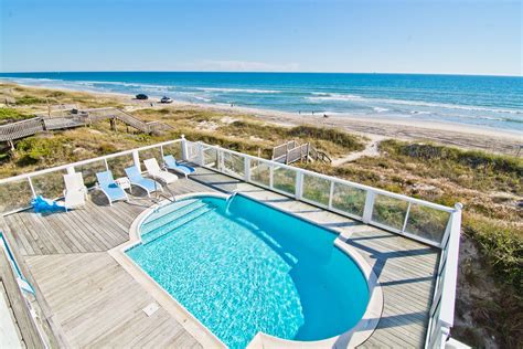 Bluewater vacation rentals - Blue Water - vacation rental in Crystal Coast: Emerald Isle Oceanfront house - - Bluewater - Enjoy the view of seemingly endless Blue Water in this 7-Bedroom, 5-Bath home on three living levels. Located in the exclusive Dolphin Ridge subdivision at the end of a quiet cul-de-sac street on an oceanfront "rear …